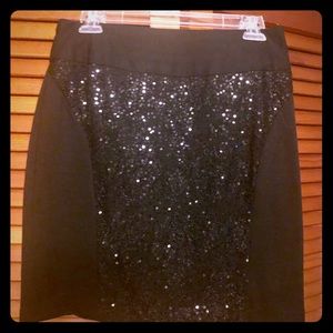 Black sequins mini skirt.